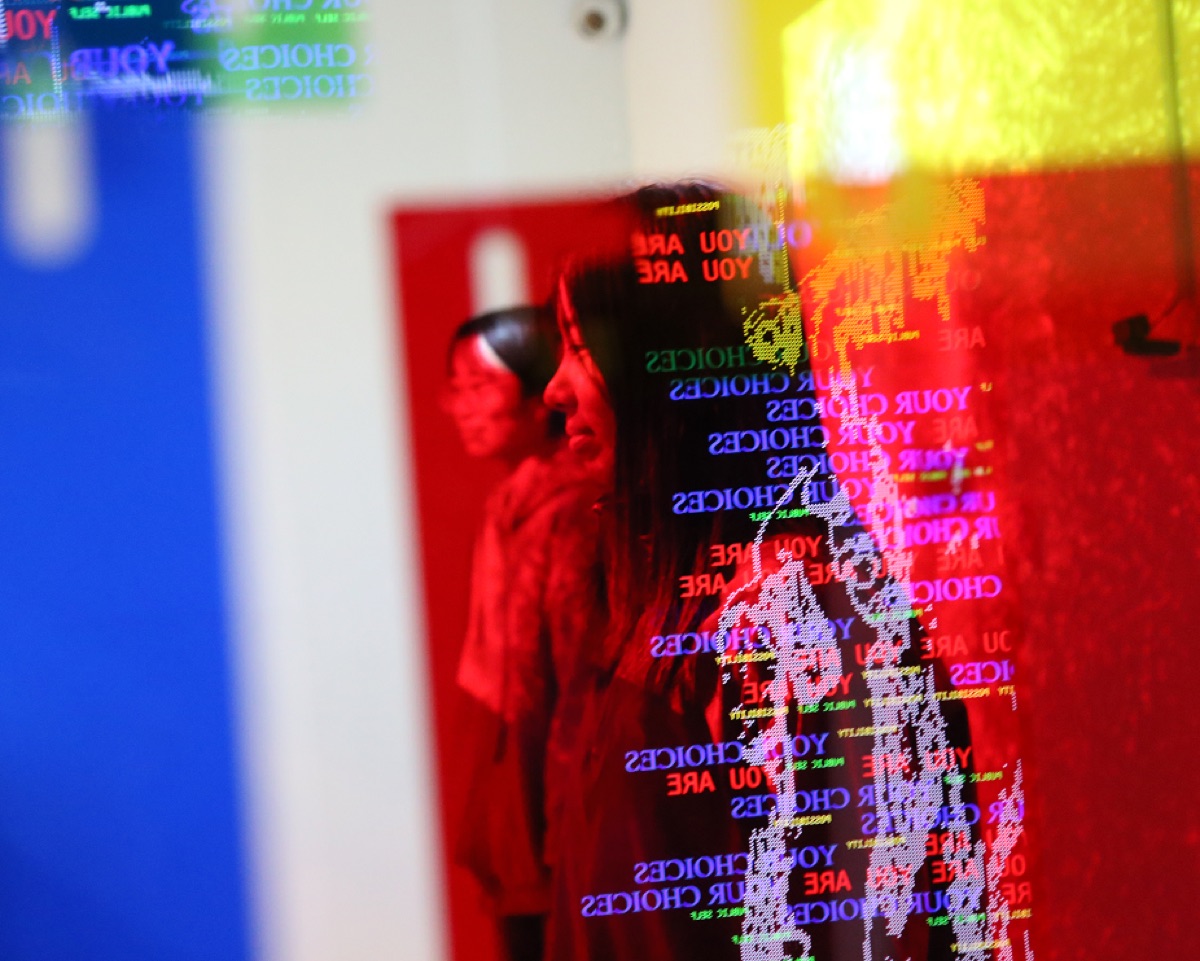 Visitor interacting with projection